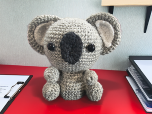 Crochet Koala on Red Desk